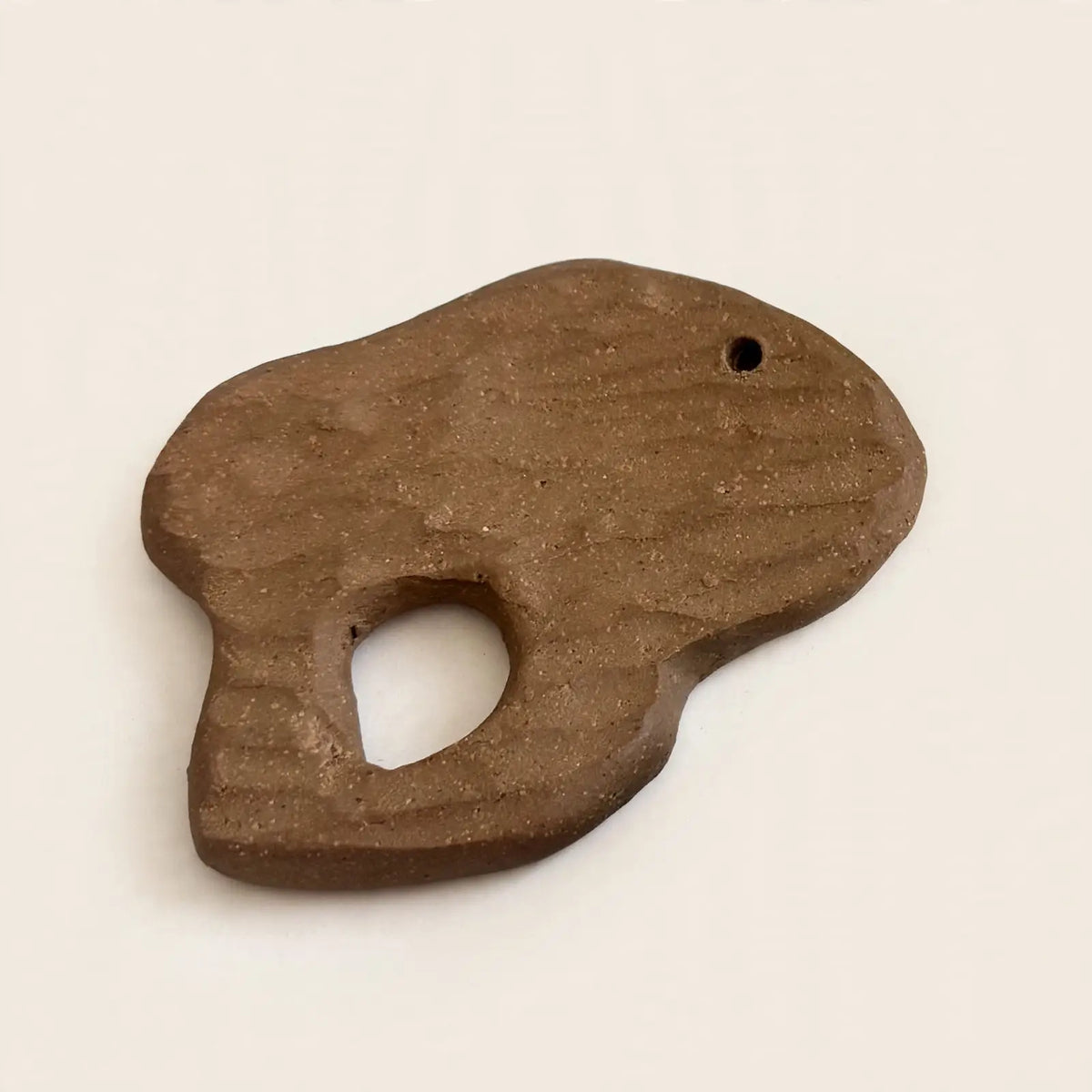 Urganiqa Foraged tree bark ceramic incense holder in brown stoneware