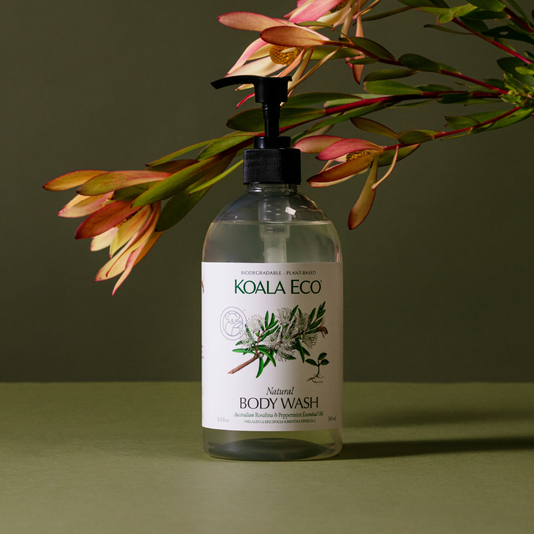 Bottle of Koala Eco natural body wash with a label featuring plant imagery on a green background.