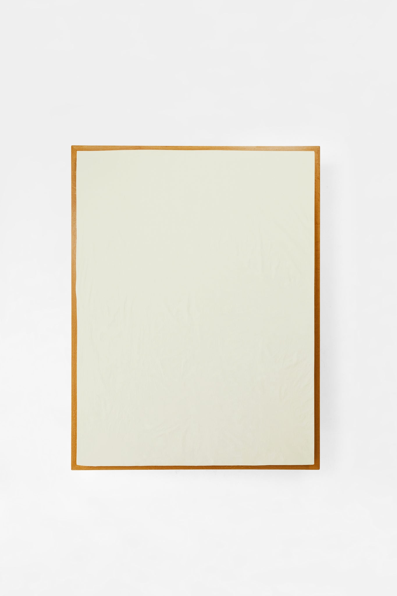 Studio Sutram Canvas fitted sheet in warm off-white organic cotton percale on a mattress