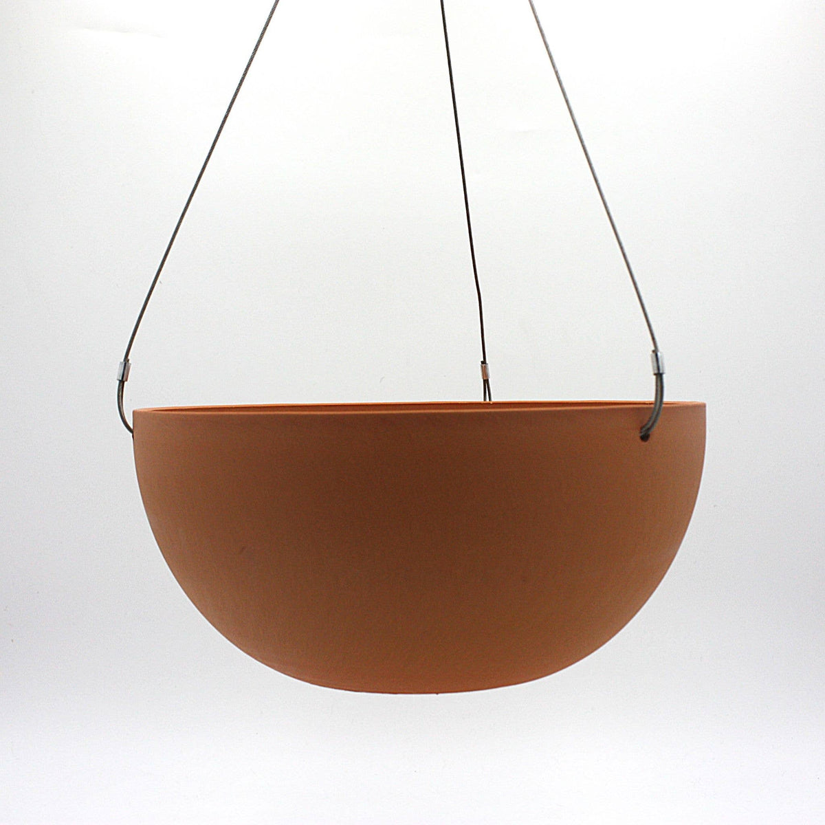Potted Charlotte hanging pot in Dusted Clay, a soft chalky terracotta, with marine wire and S hook