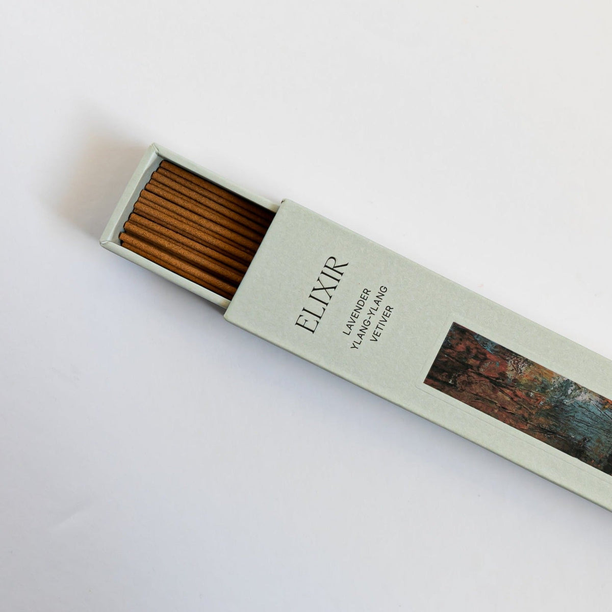 Elixir incense burning in a holder