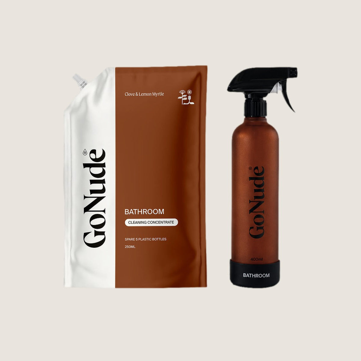 Go Nude Bathroom cleaning set with the 250ml Clove and Lemon Myrtle concentrate pouch beside the chestnut 400ml refillable glass spray bottle