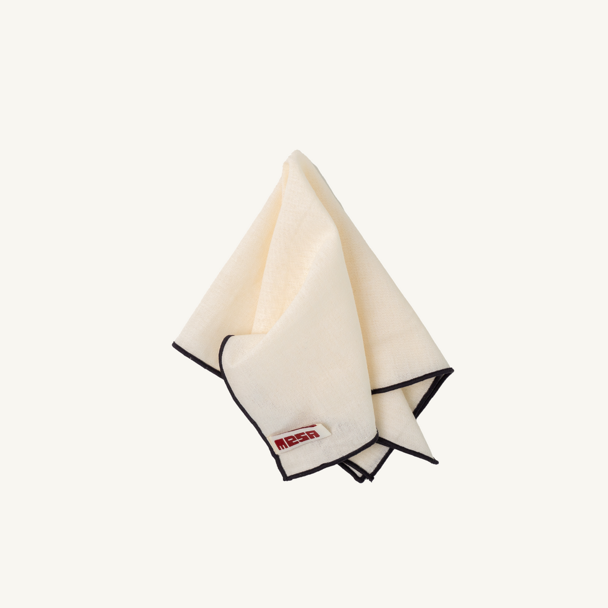 Mesa Collections napkin in ivory with black trim