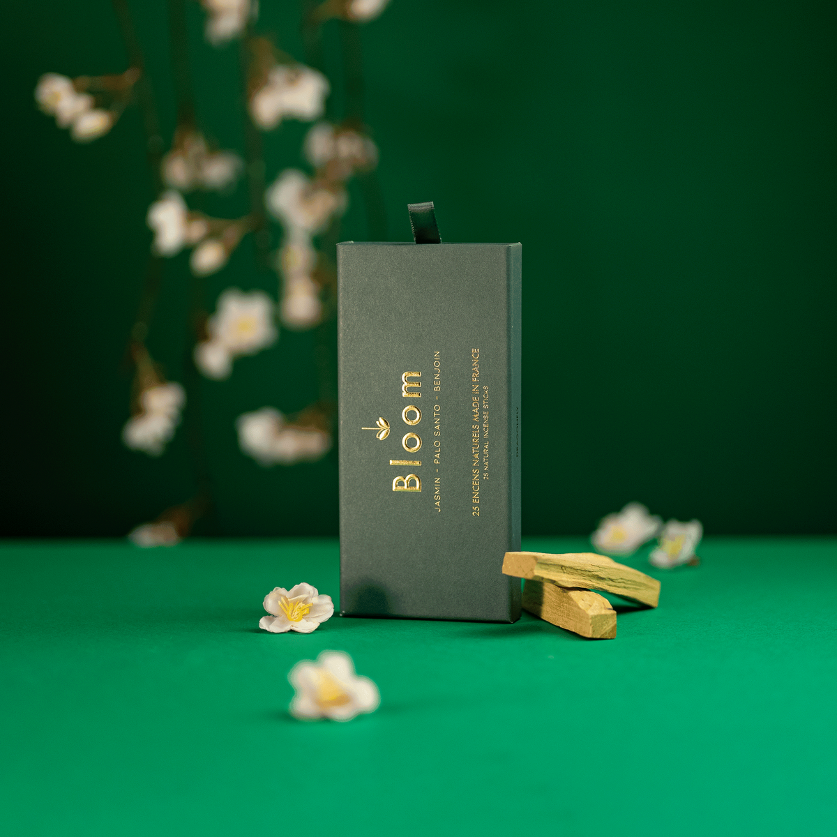 Bloom France Palo Santo incense box styled with palo santo wood and jasmine flowers