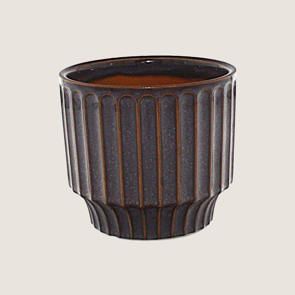 Potted small Pillar planter in Plum on a greige background