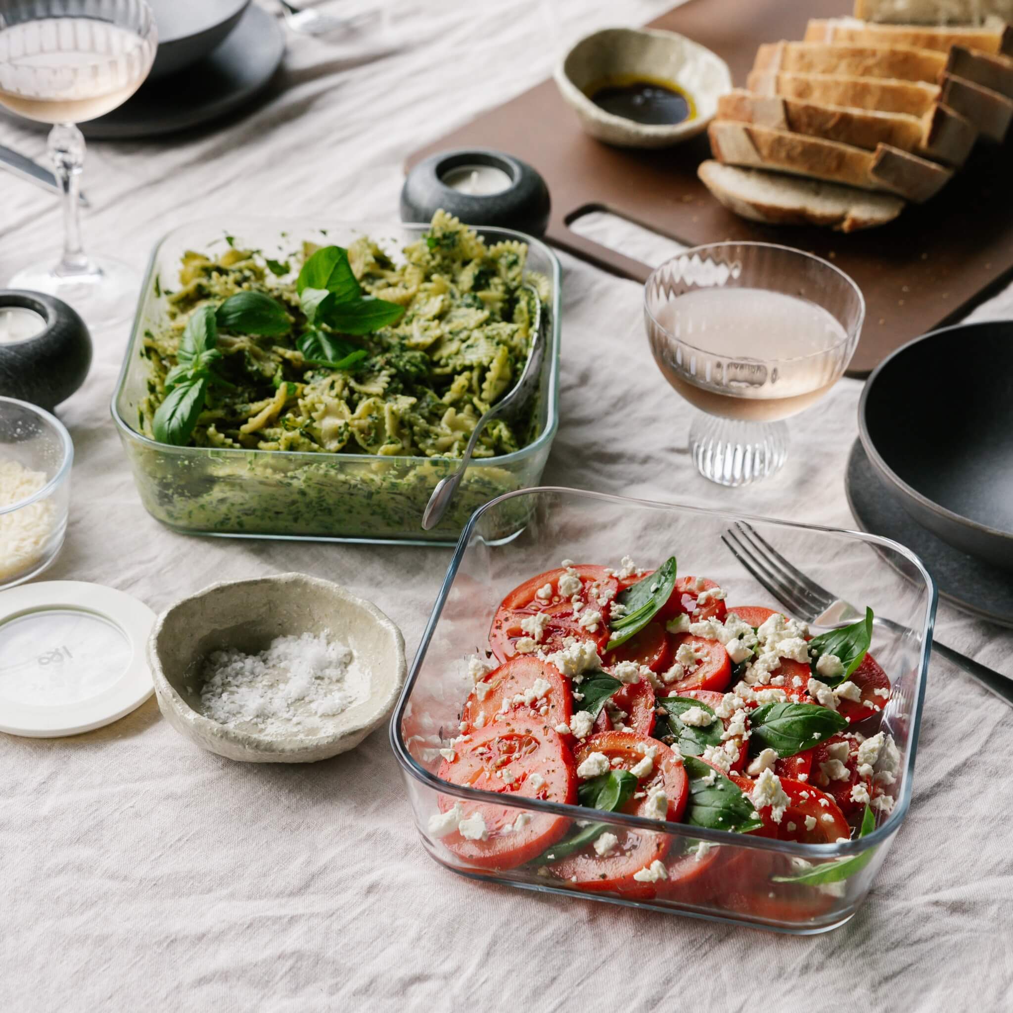 Seed & Sprout glass containers with salads on a styled table