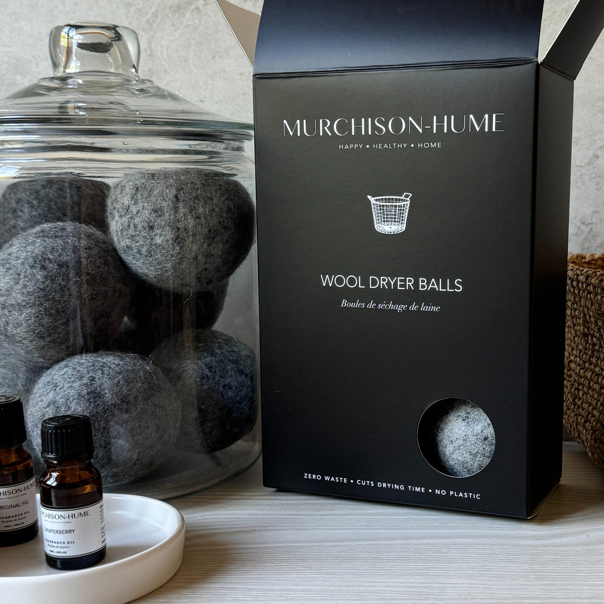 Murchison-Hume wool dryer balls on a laundry shelf