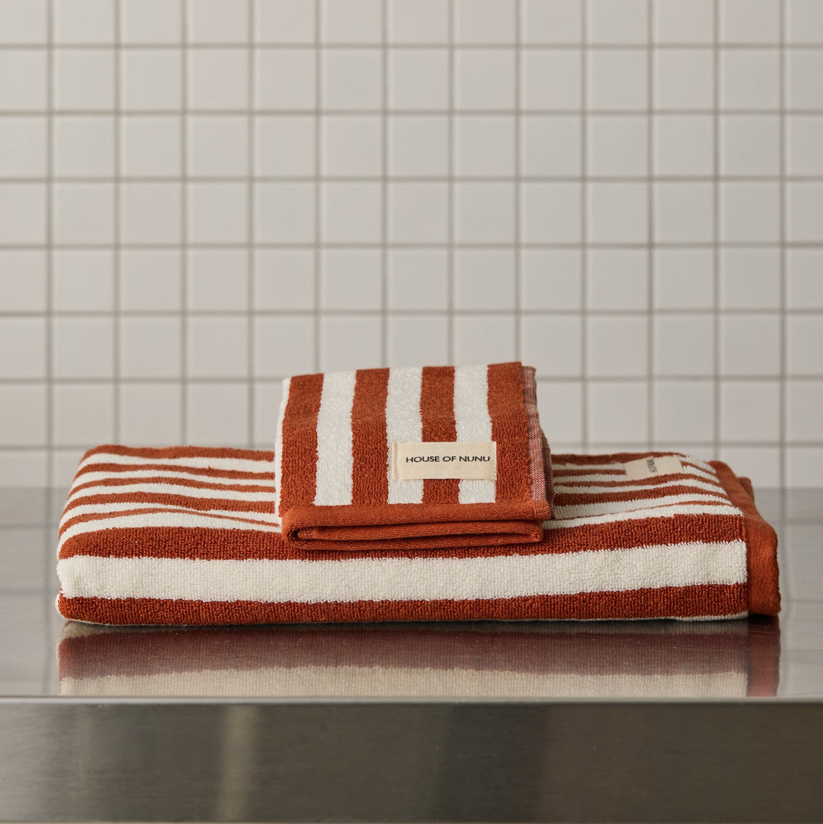 House of Nunu Red Ochre Stripe towels styled