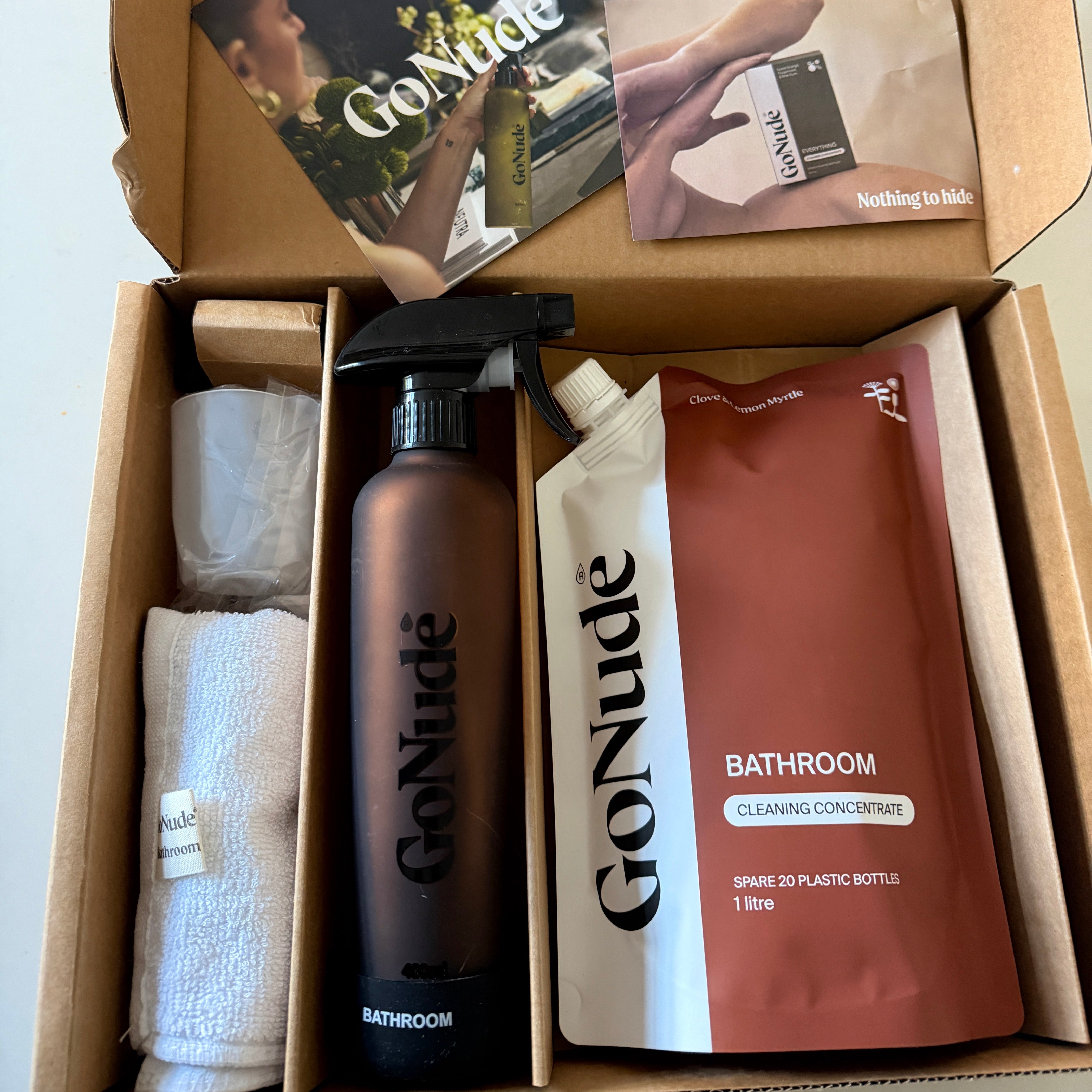 Go Nude Bathroom cleaning concentrate 1 litre pouch in Clove and Lemon Myrtle, with a refillable spray bottle and cloth