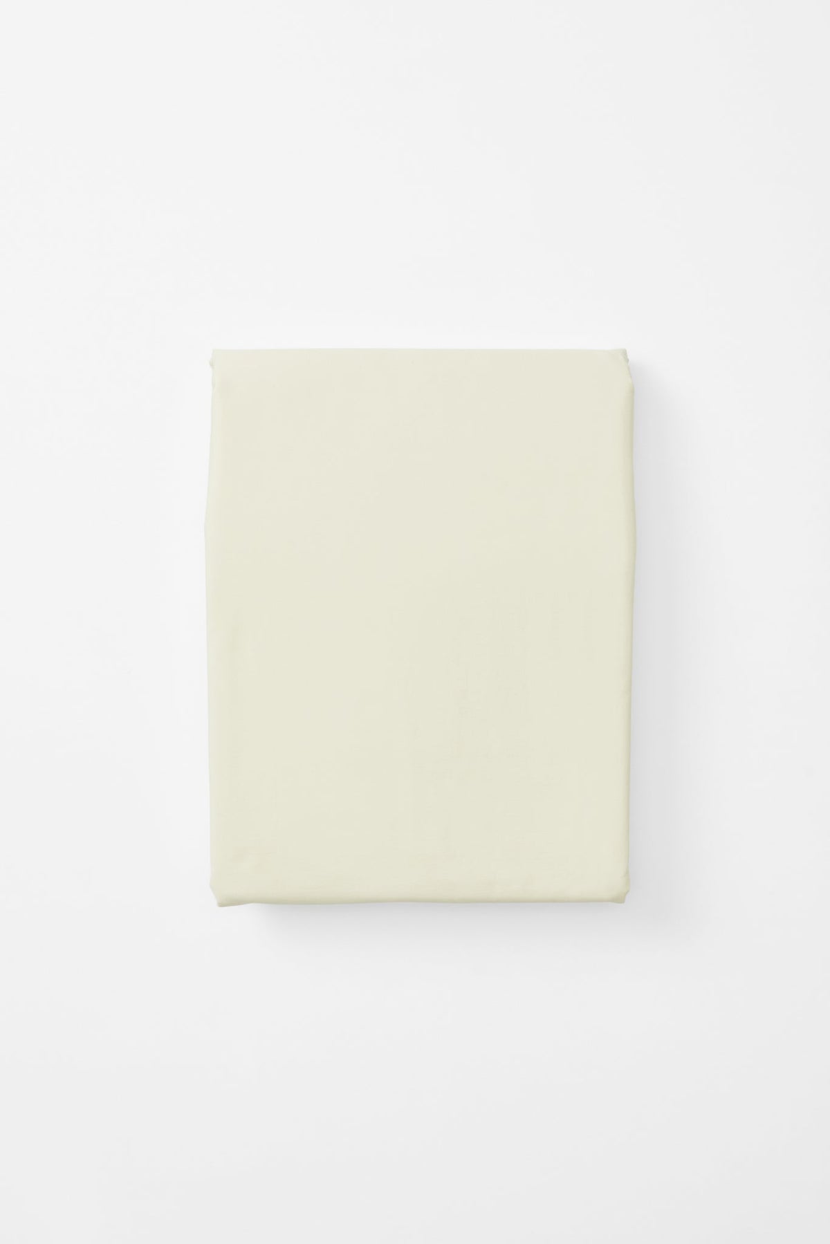 Studio Sutram Canvas duvet cover folded back at the top of a bed