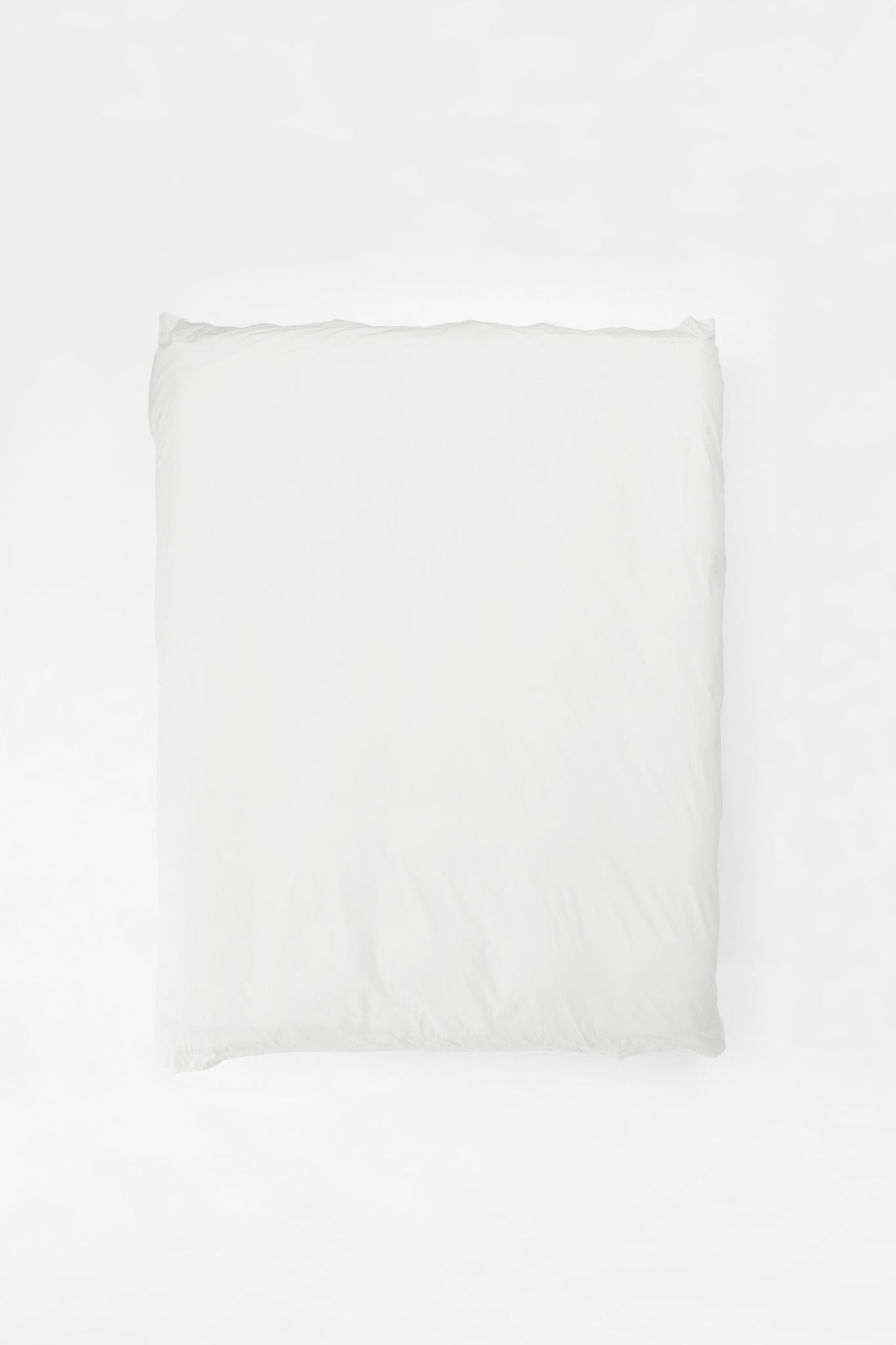 Studio Sutram Prism duvet cover in pure white organic cotton percale on a bed
