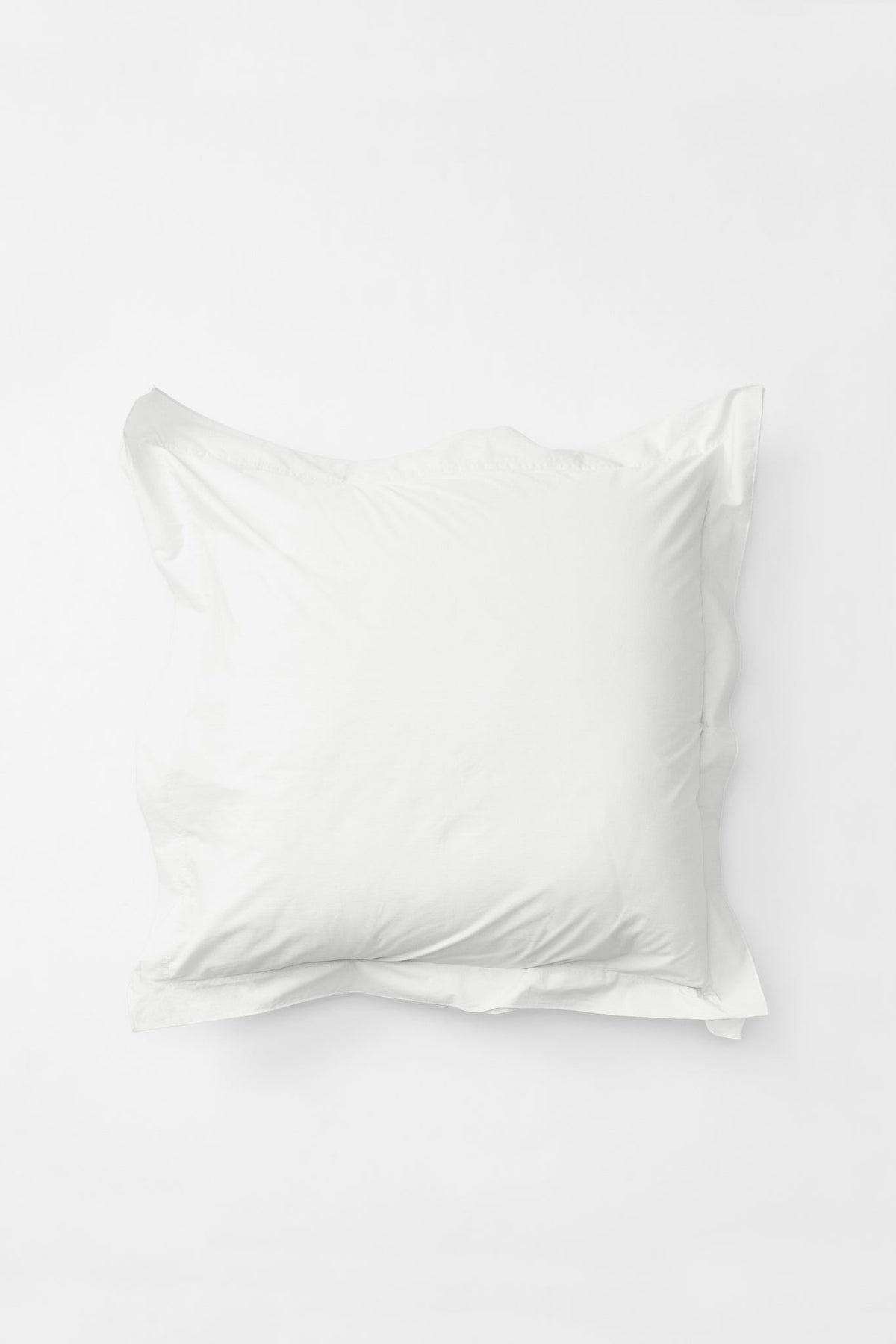 Studio Sutram Prism euro pillowcase pair in pure white, with colour-matched embroidered border
