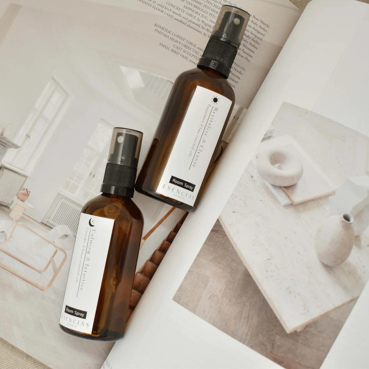 Esencias Calming & Intuition and Revitalise & Cleanse room sprays with a magazine