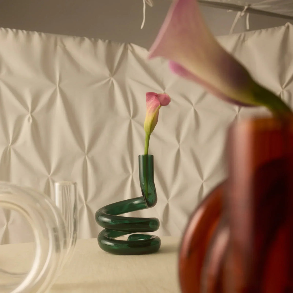 House of Nunu Teal Glass Cobra Vase styled with flowers