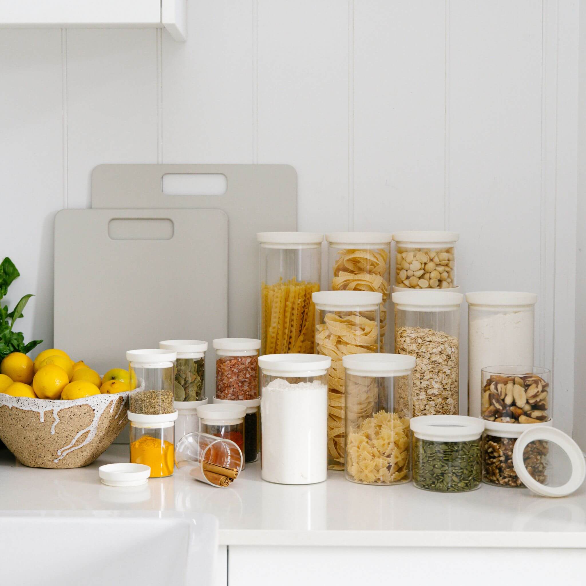 Seed & Sprout glass pantry jars styled on a kitchen bench