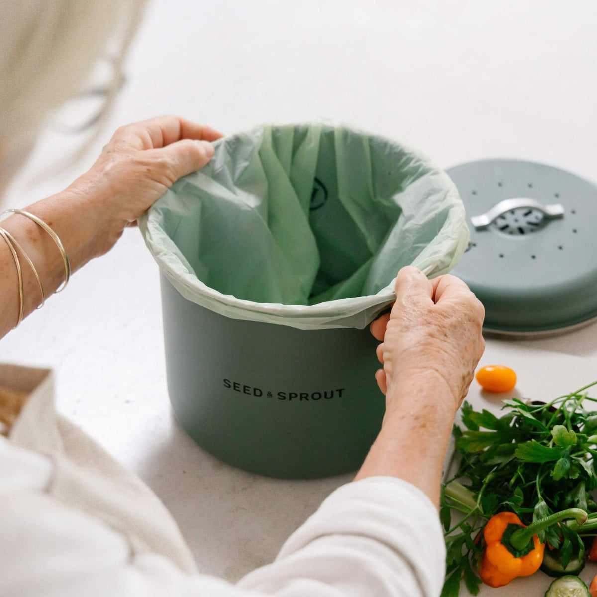 Seed and Sprout compostable bin liner holding food scraps