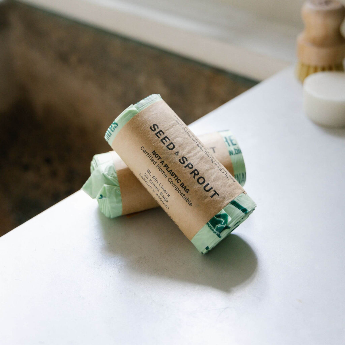 Seed and Sprout compostable bin liner in a kitchen compost caddy