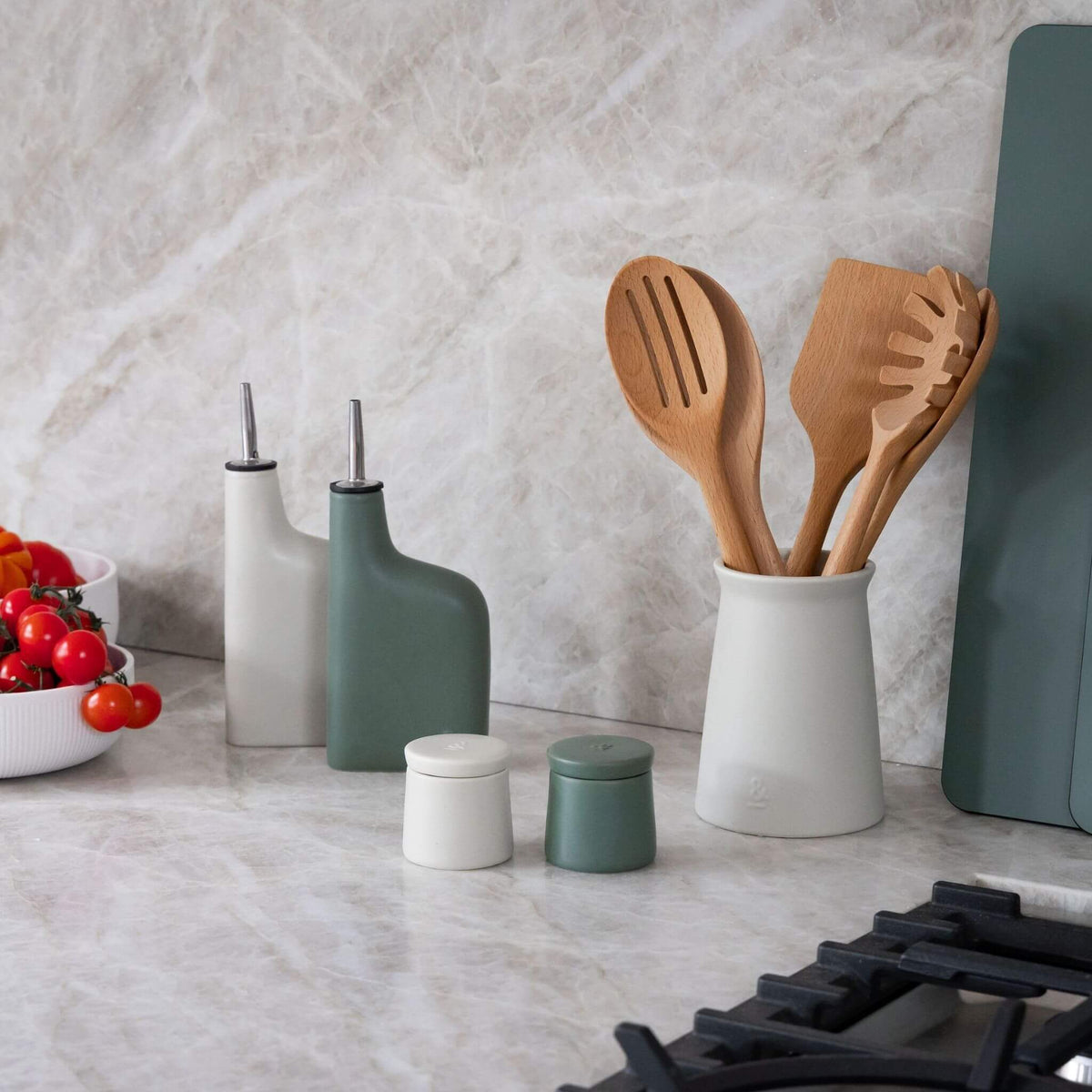 Ceramic utensil holder on a kitchen bench