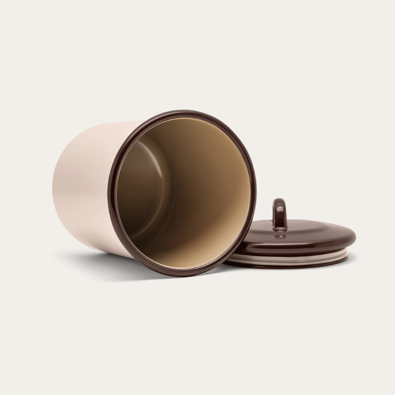 Macadamia enamel storage jar on its side with the lid off, showing the silicone-sealed rim and interior