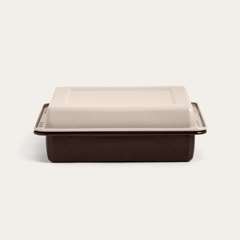 The two Macadamia enamel trays stacked and locked closed, showing the edge indents