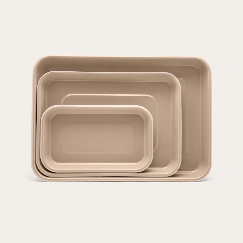 The three Macadamia enamel baking trays nested inside each other
