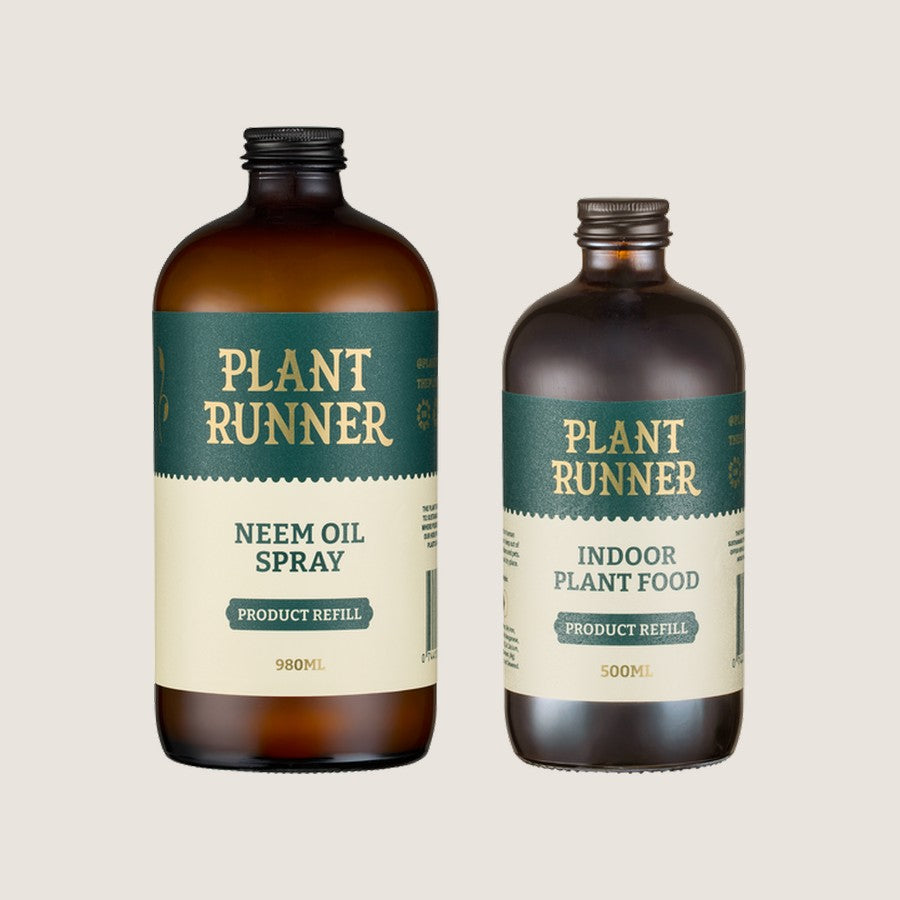 Plant Runner Keep It Growing Pack: 980ml Neem Oil Spray refill and 500ml Indoor Plant Food refill in amber glass bottles
