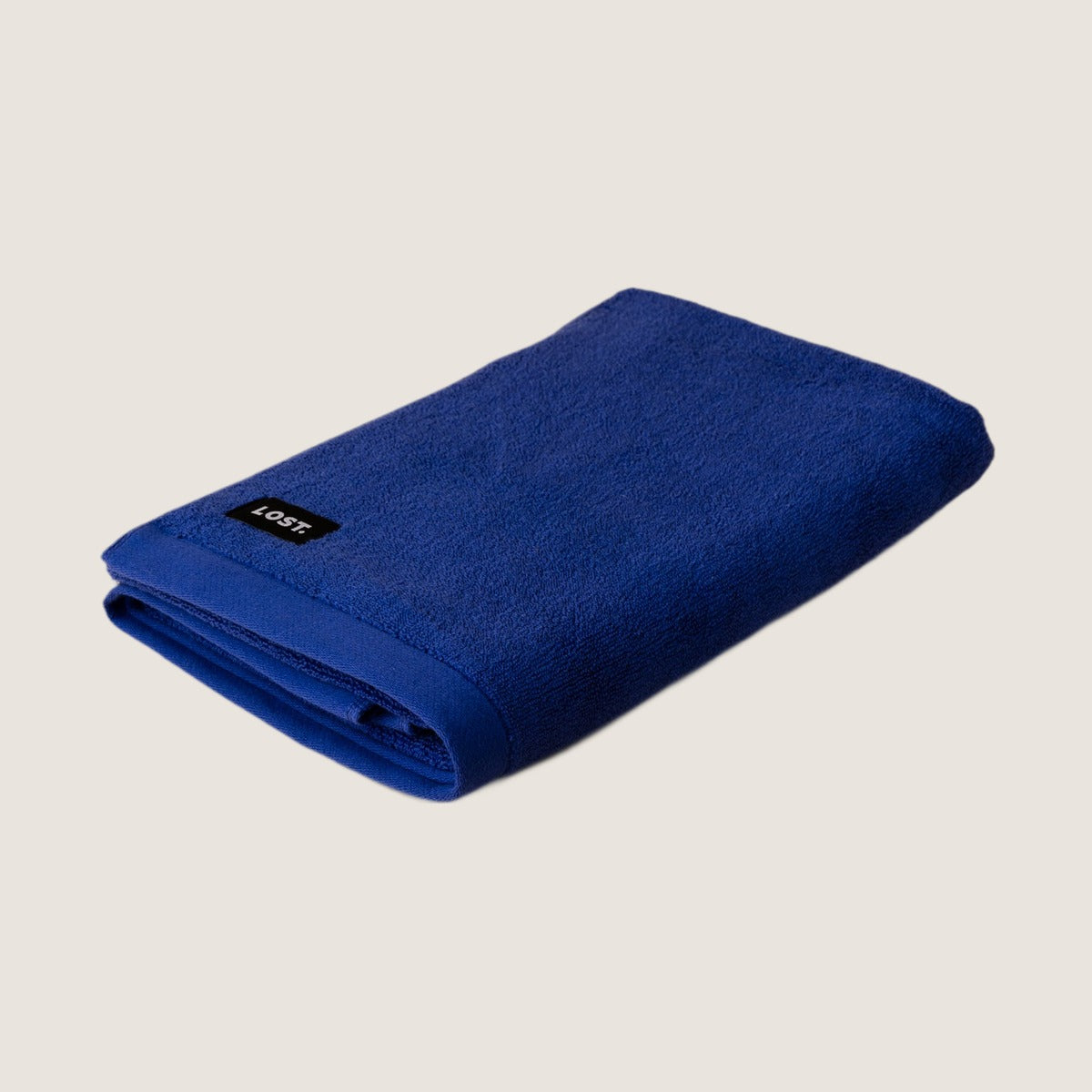 Lost Towels Electric Blue bath towel on greige