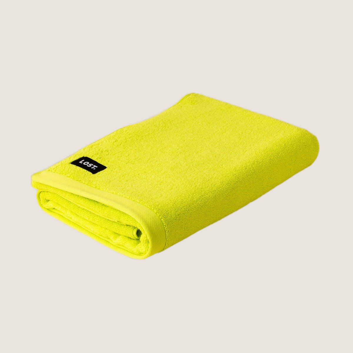 Lost Towels Chartreuse bath towel on greige