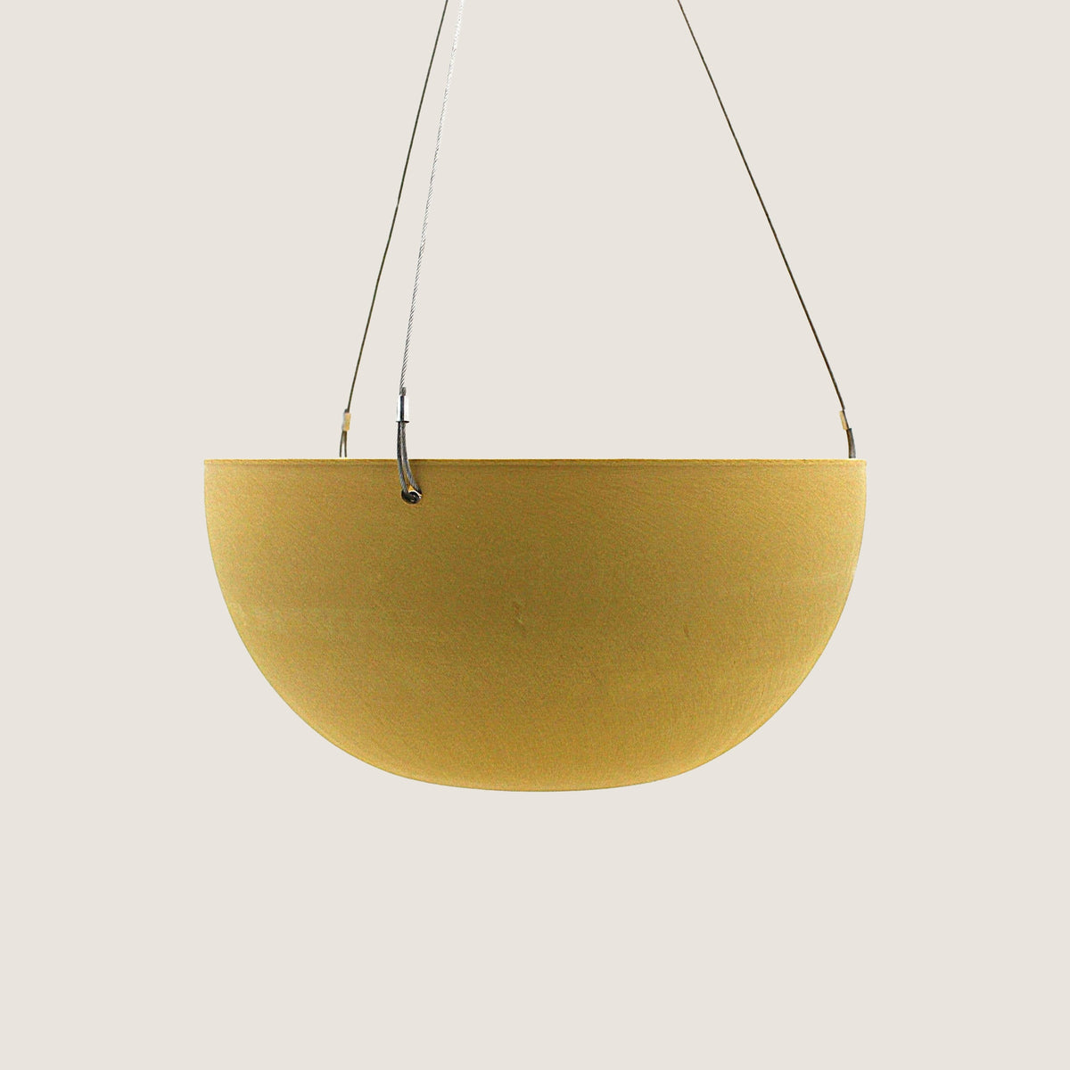Potted Charlotte hanging pot in Mustard on a greige background