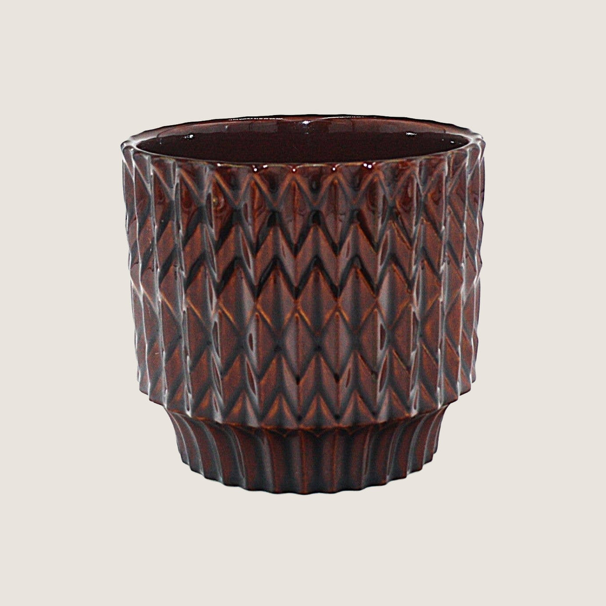 Potted medium Trippy planter in Burnt Umber on a greige background