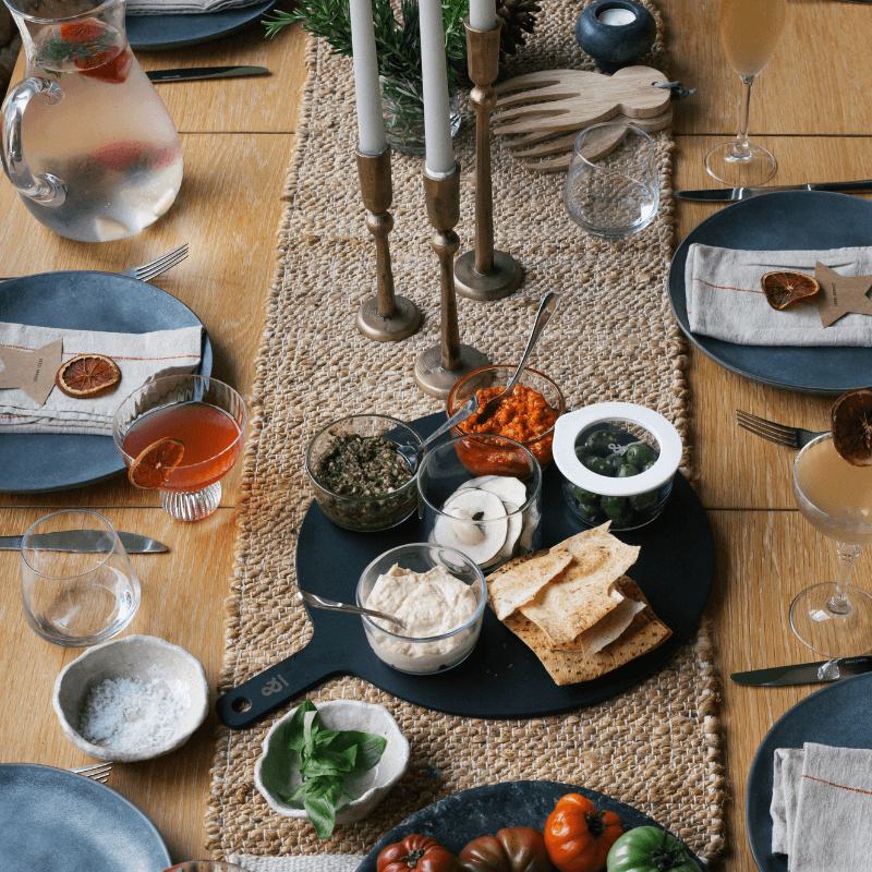 Glass dip bowls on a serving board