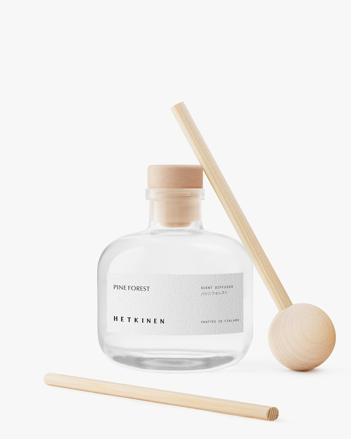Detail of the Hetkinen Pine Forest 200ml diffuser bottle and reeds