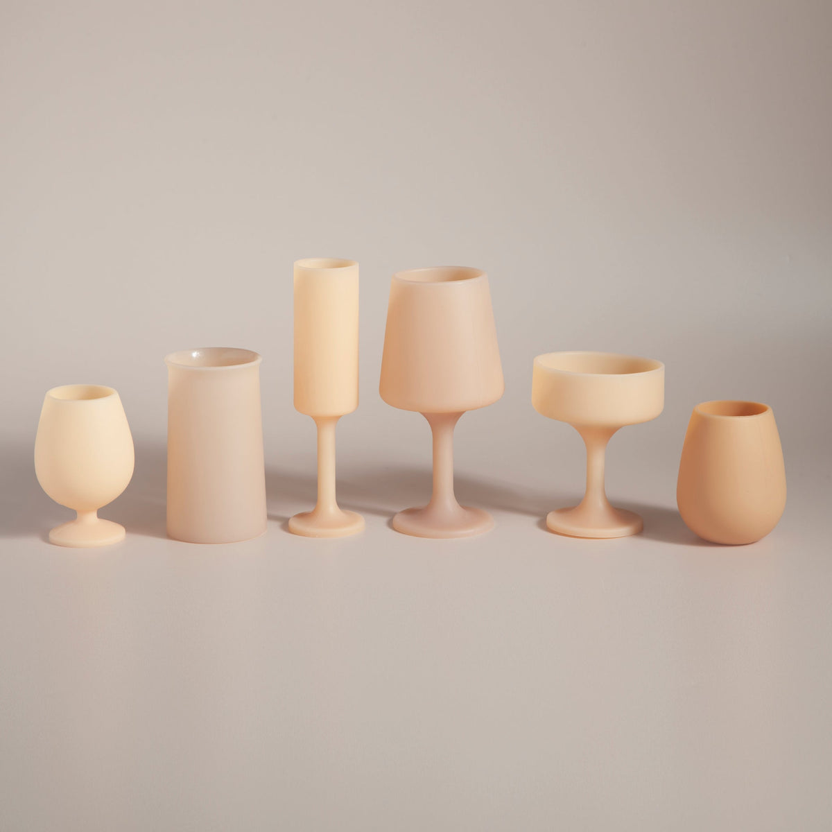 Wheat and oat Stegg silicone highball glasses styled on a table